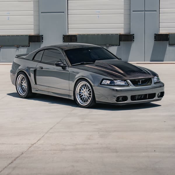 Supercharged 2003 Cobra with a full JL Audio system
